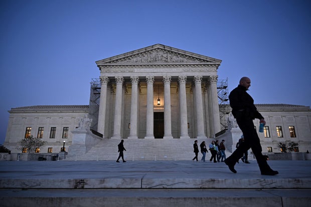 People walk past the Supreme Court in Washington, D.C., on Nov. 13, 2023.