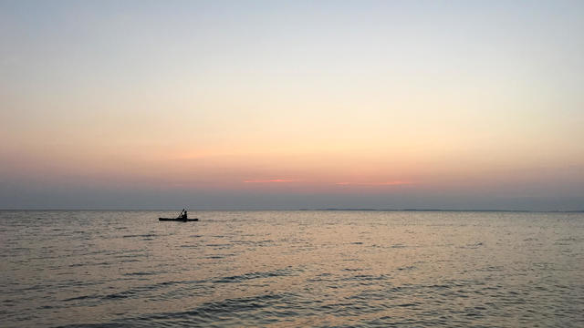 Kayak silhouetted at Sunset on the Chesapeake Bay 