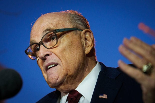 Rudy Giuliani speaks to the press as he leaves the U.S. District Courthouse on Dec. 11, 2023, in Washington, D.C.