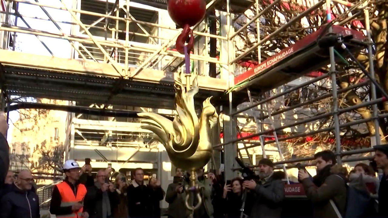 New golden rooster weathervane installed atop Notre Dame Cathedral spire -  CBS News