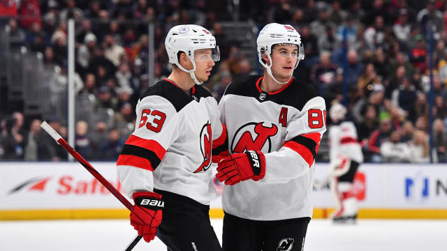 Jack Hughes #86 of the New Jersey Devils celebrates his second period goal with teammate Jesper Bratt #63 of the New Jersey Devils during a game against the Columbus Blue Jackets at Nationwide Arena on December 16, 2023 in Columbus, Ohio. 