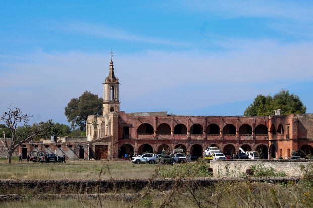 Authorities work at the scene of an attack at a posada, in Salvatierra