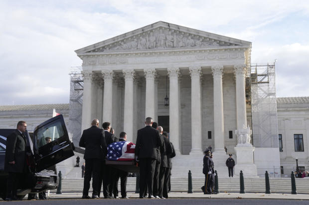 The flag-draped casket of retired Supreme Court Justice Sandra Day O'Connor arrives at the Supreme Court in Washington, Monday, Dec. 18, 2023. 