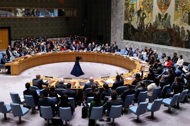 Ambassadors vote during a meeting of the U.N Security Council 