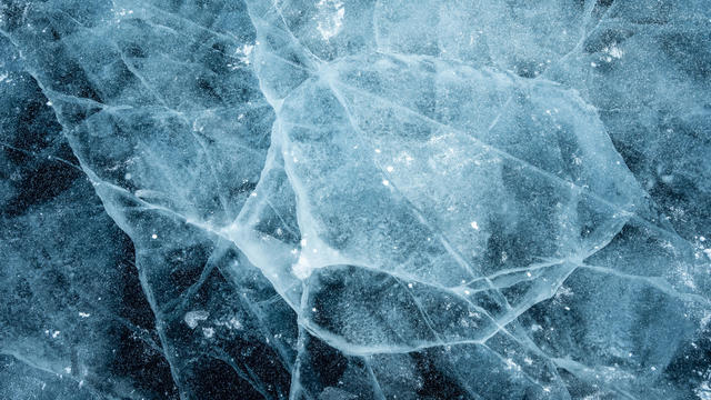 Beautiful cracks surface of the frozen lake of Baikal lake in winter season. 