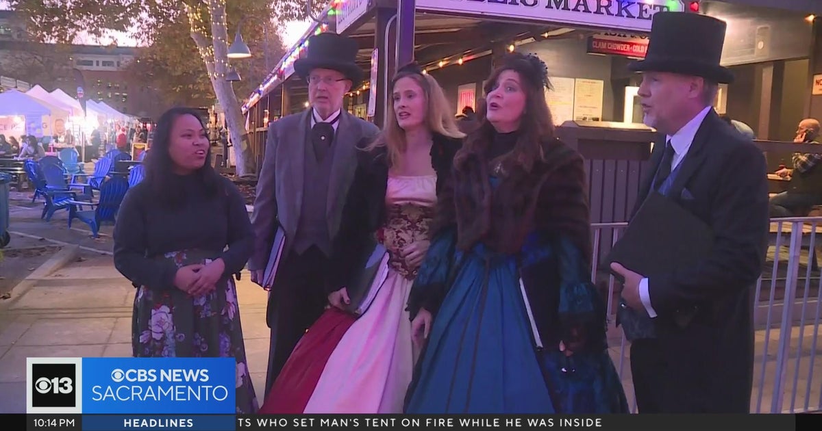 Group uses song, Christmas cheer in Old Sacramento to call for golbal harmony