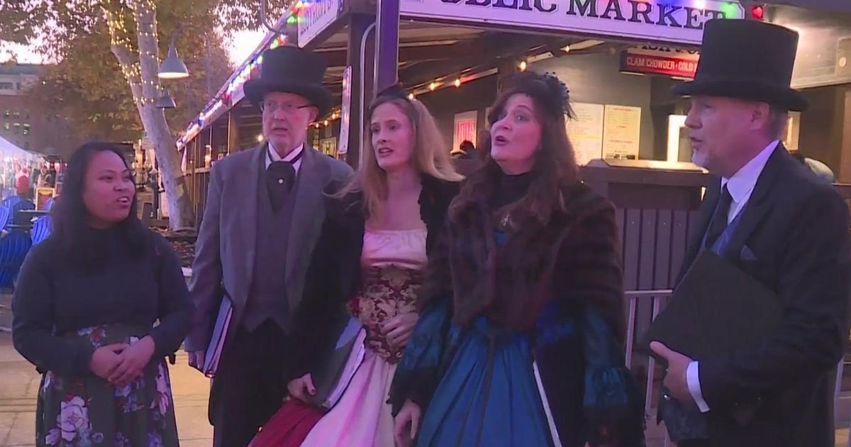 Group uses song, Christmas cheer in Old Sacramento to call for global harmony