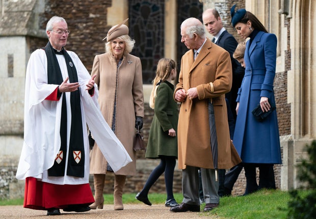 Queen Camilla and King Charles III greet the clergyman after Christmas Day services at St. Mary Magdalene Church in Sandringham, Dec. 25, 2023