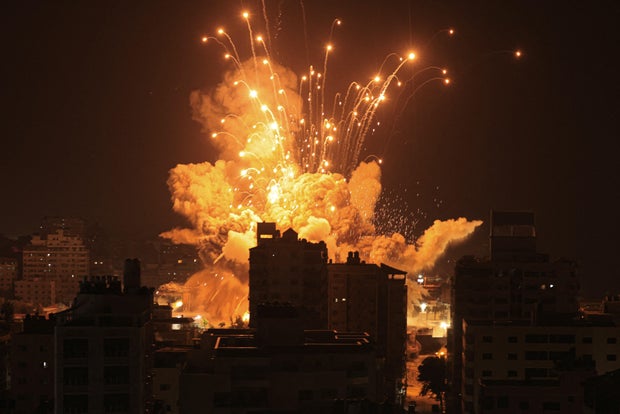 A missile explodes in Gaza City during an Israeli air strike