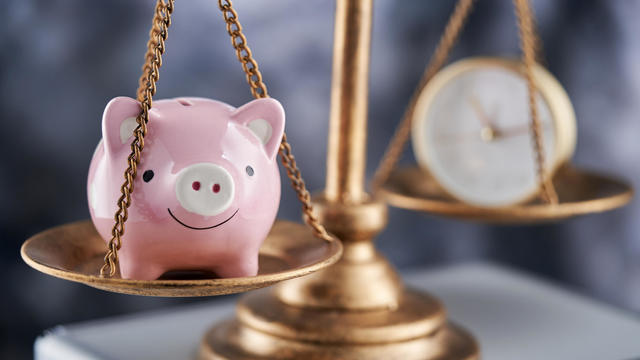 Balance of piggy bank and alarm clock - time and money,Malaysia 