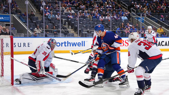 Darcy Kuemper #35 of the Washington Capitals tends net against Jean-Gabriel Pageau #44 of the New York Islanders during the third period at UBS Arena on December 29, 2023 in Elmont, New York. 