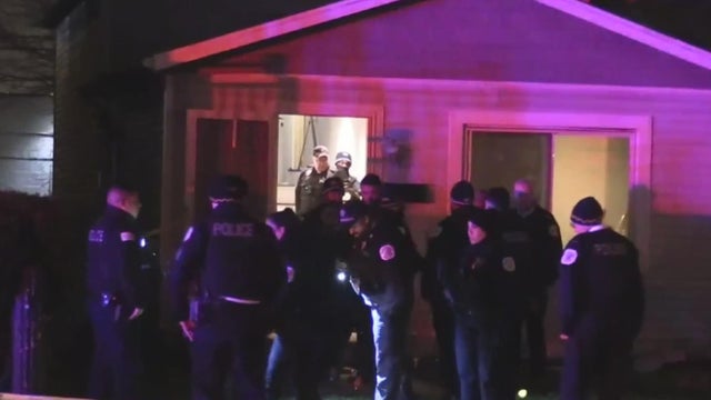 police lights and yellow police tape at crime scene 