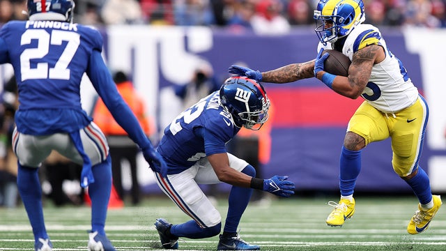 Kyren Williams #23 of the Los Angeles Rams stiff arms Adoree' Jackson #22 of the New York Giants during the first quarter at MetLife Stadium on December 31, 2023 in East Rutherford, New Jersey.