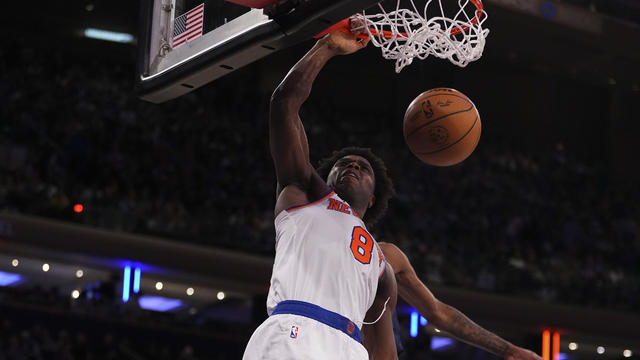 OG Anunoby #8 of the New York Knicks dunks the ball against Jaden McDaniels #3 of the Minnesota Timberwolves at Madison Square Garden on January 1, 2024 in New York City. 