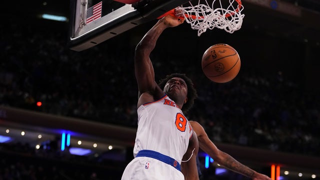 OG Anunoby #8 of the New York Knicks dunks the ball against Jaden McDaniels #3 of the Minnesota Timberwolves at Madison Square Garden on January 1, 2024 in New York City.