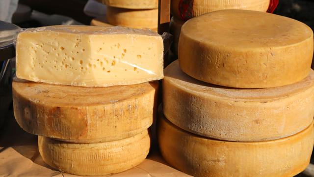 tasty mature cheese with holes for sale in the market 