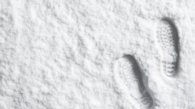 Landscape powder snow scene with foot prints