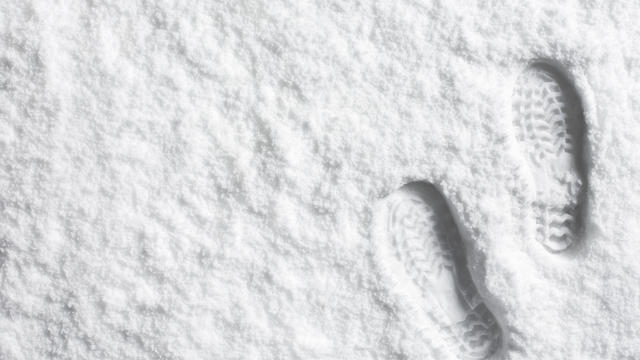 Landscape powder snow scene with foot prints 