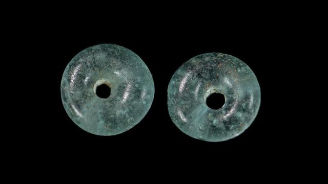 doughnut-shaped-translucent-light-turquoise-glass-beads-c-wessex-archaeology.jpg 