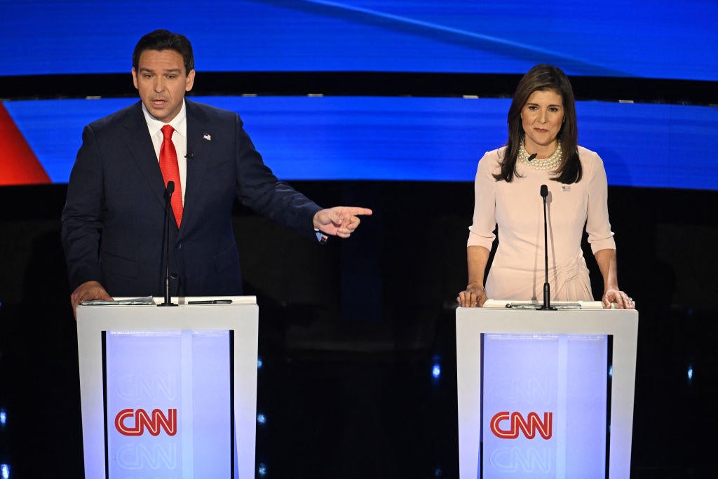 Florida Gov. Ron DeSantis and former U.N. Ambassador Nikki Haley speak during the fifth Republican presidential primary debate at Drake University in Des Moines, Iowa, on Jan. 10, 2024. 
