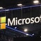 Microsoft briefly outshines Apple as most-valuable company amid AI mania