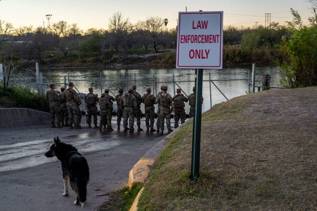 National Guard soldiers stand guard on the banks of the Rio Grande river at Shelby Park on Jan. 12, 2024, in Eagle Pass, Texas.