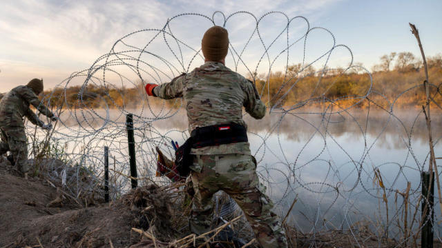 National Guard soldiers stand guard on the banks of the Rio Grande river at Shelby Park on Jan. 12, 2024, in Eagle Pass, Texas. 