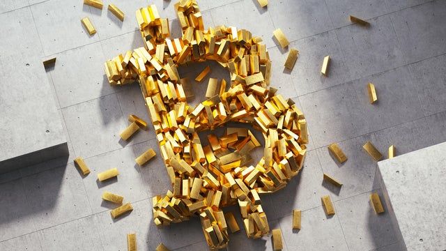 Bitcoin sign made out of golden bars