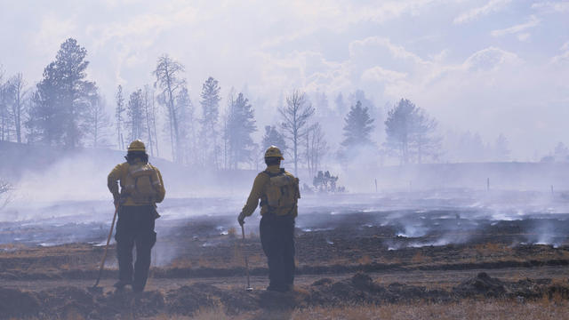 Firefighters fighting a smoky wildfire in Montana 