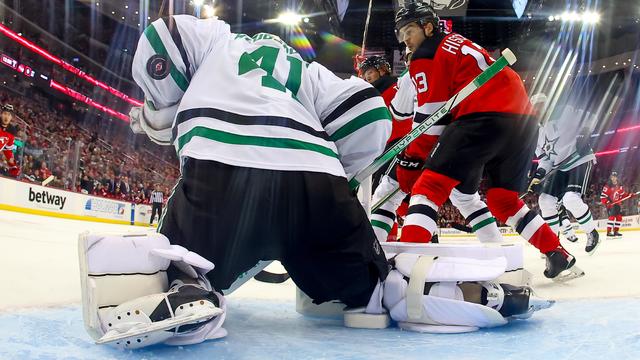 Scott Wedgewood #41 of the Dallas Stars makes a save with Nico Hischier #13 of the New Jersey Devils in front during the second period of the game at the Prudential Center on January 20, 2024 in Newark, New Jersey. 