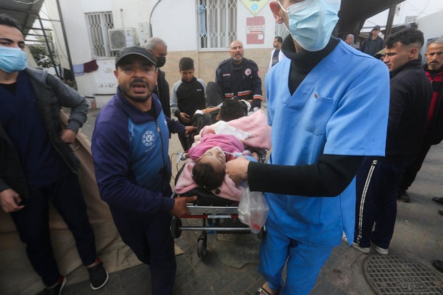 Palestinians wounded during the Israeli air and ground offensive in Khan Younis, southern Gaza, are brought to a hospital in nearby Rafah, Jan. 23, 2024