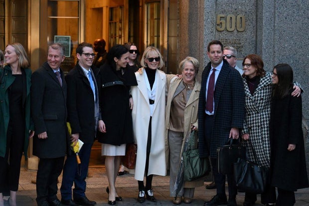 E. Jean Carroll, in a white coat, leaves federal court after the verdict in her defamation case against former President Donald Trump in New York on Jan. 26, 2024.