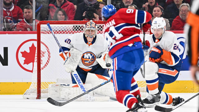Sean Monahan #91 of the Montreal Canadiens takes a shot towards goaltender Semyon Varlamov #40 of the New York Islanders during the third period at the Bell Centre on January 25, 2024 in Montreal, Quebec, Canada. 