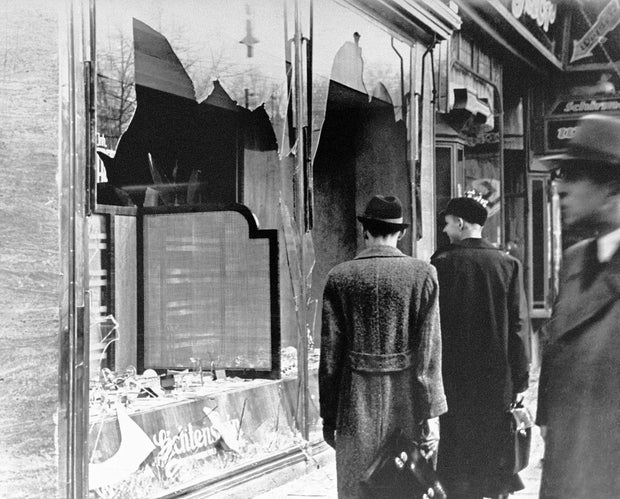 Germany: Shattered storefront of a Jewish-owned shop destroyed during Kristallnacht, Berlin, 1938