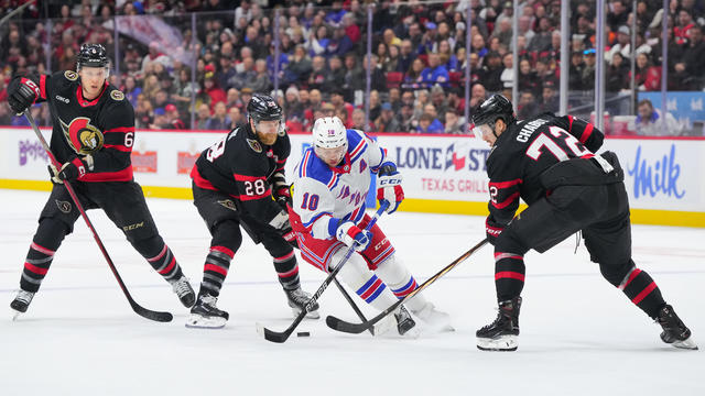 Artemi Panarin #10 of the New York Rangers skates with the puck against Claude Giroux #28, Thomas Chabot #72 and Jakob Chychrun #6 of the Ottawa Senators during the first period at Canadian Tire Centre on January 27, 2024 in Ottawa, Ontario, Canada. 