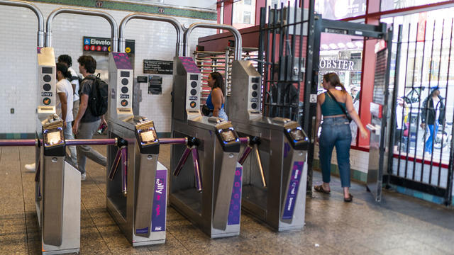 People go through the exit door without paying the MTA fare at a subway station in middle Manhattan on June 5, 2023 in New York City. 