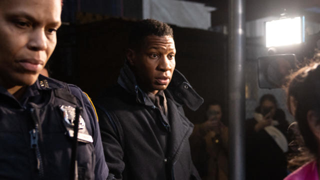 US actor Jonathan Majors (C) leaves a courtroom after being found guilty of assault and harassment of his former girlfriend, at the Manhattan criminal courts in New York City on December 18, 2023. 