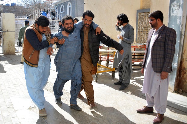 Pakistan election offices hit by twin bombings, killing at least 24 people a day before parliamentary vote