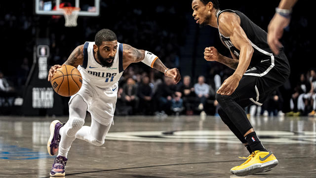 Dallas Mavericks guard Kyrie Irving (11) drives to the basket against Brooklyn Nets center Nic Claxton during the first half of an NBA basketball game in New York, Tuesday, Feb. 6, 2024. 