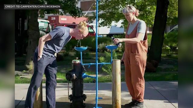 Water fountains hooked up to fire hydrant. 