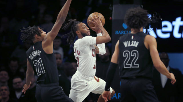 Cleveland Cavaliers guard Darius Garland (10) looks to pass the ball while being defended by Brooklyn Nets forwards Noah Clowney (21) and Jalen Wilson (22) during the first half of an NBA basketball game Thursday, Feb. 8, 2024, in New York. 