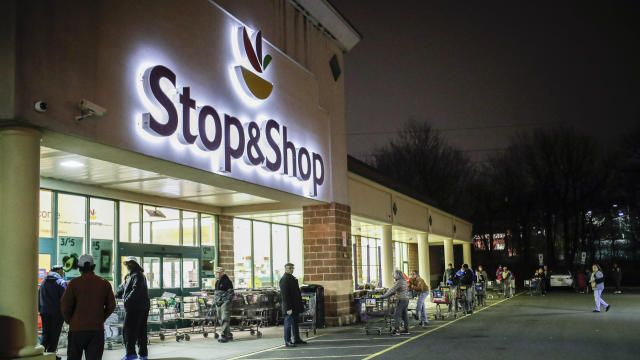 In this Friday, March 20, 2020 file photo, customers wait in line at a Stop & Shop supermarket that opened special morning hours to serve people 60-years and older due to coronavirus concerns, in Teaneck, N.J. 