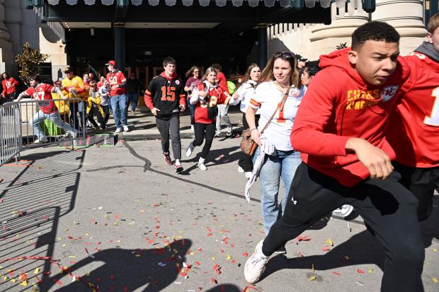 People flee after shots were fired near the Kansas City Chiefs' Super Bowl victory parade on Feb. 14, 2024, in Kansas City, Missouri. 