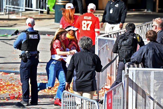 Fans leave the area of the Kansas City Chiefs' Super Bowl celebration after shots were fired Feb. 14, 2024, in Kansas City, Missouri.