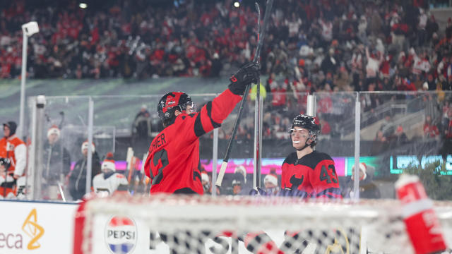 New Jersey Devils center Nico Hischier (13) celebrates after scoring a goal during a NHL Stadium Series game between the Philadelphia Flyers and New Jersey Devils on February 17, 2024 at Metlife Stadium in East Rutherford, New Jersey. 