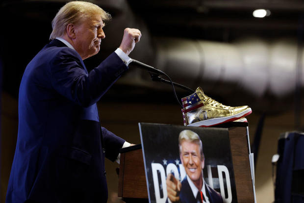 Trump hawks $399 branded shoes at Sneaker Con, a day after a $355 million ruling against him