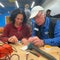 Volunteers in a California fix it clinic help neighbors salvage broken electronics
