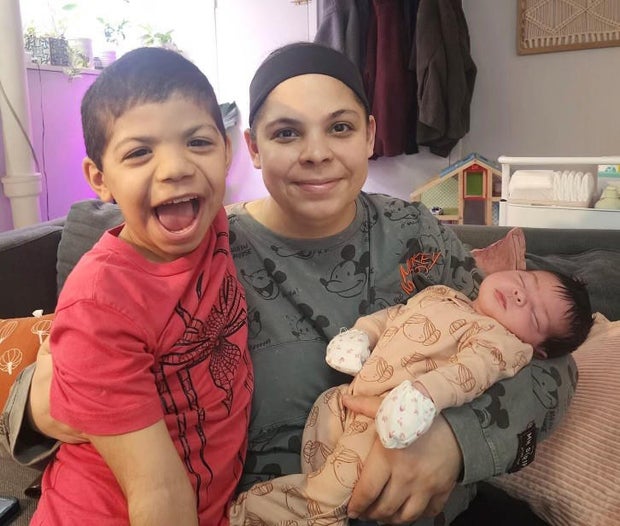Mary Delgado with her children, Joaquin and baby Emiliana