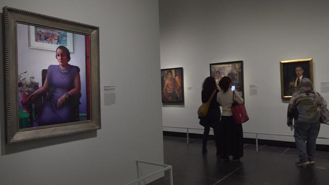 Visitors at the Met look at paintings in the "Harlem Renaissance and Transatlantic Modernism" exhibit. 