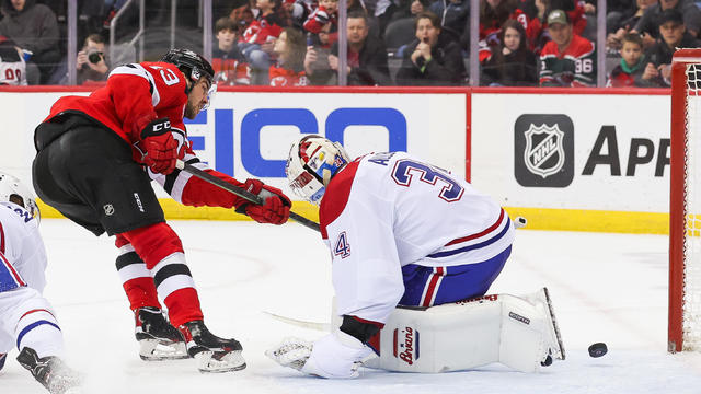 New Jersey Devils center Nico Hischier (13) scores a goal on Montreal Canadiens goaltender Jake Allen (34) during a game between the against the against the Montreal Canadiens and New Jersey Devils on February 24, 2024 at Prudential Center in the Newark, New Jersey. 